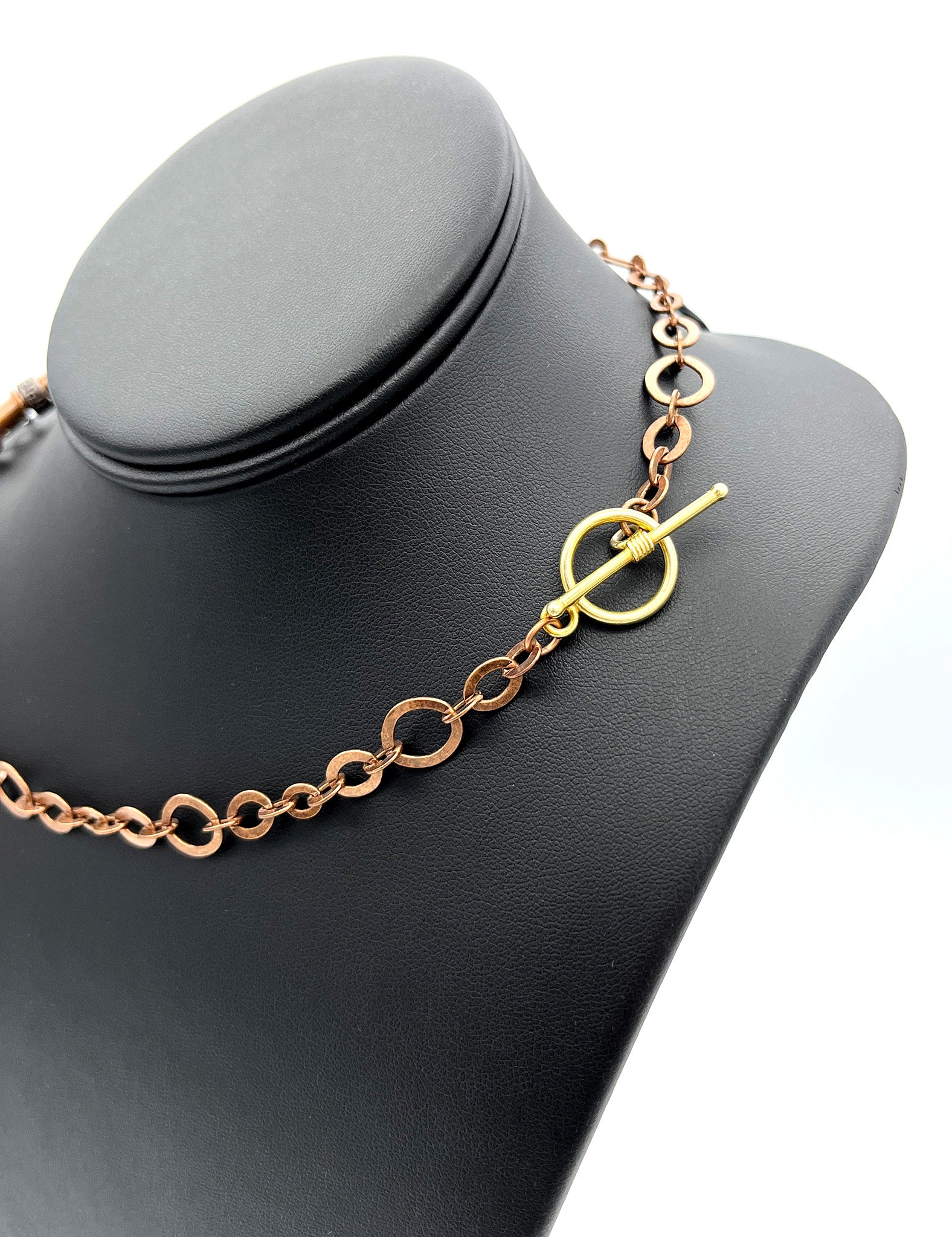 Gold toggle on copper chain