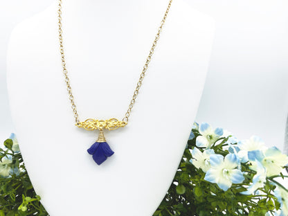 Up close look of handmade lapis lazuli and gold necklace