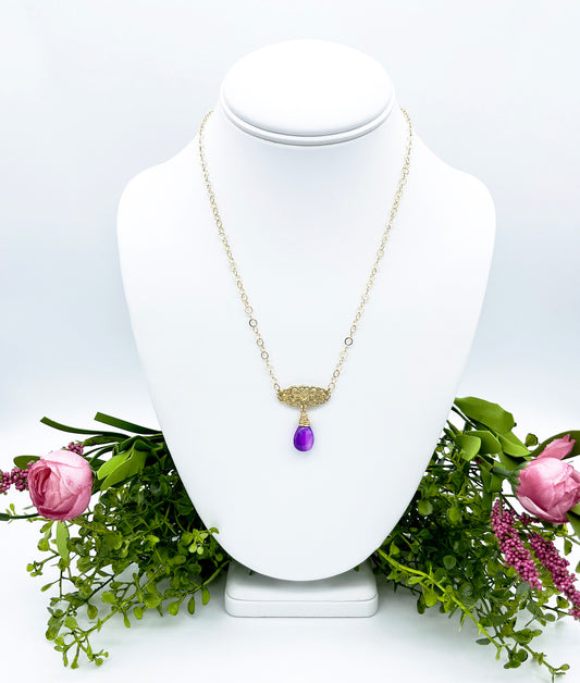 Gold and purple pearl drop necklace