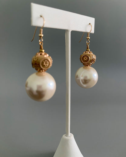 Side view of resin and pearl earrings