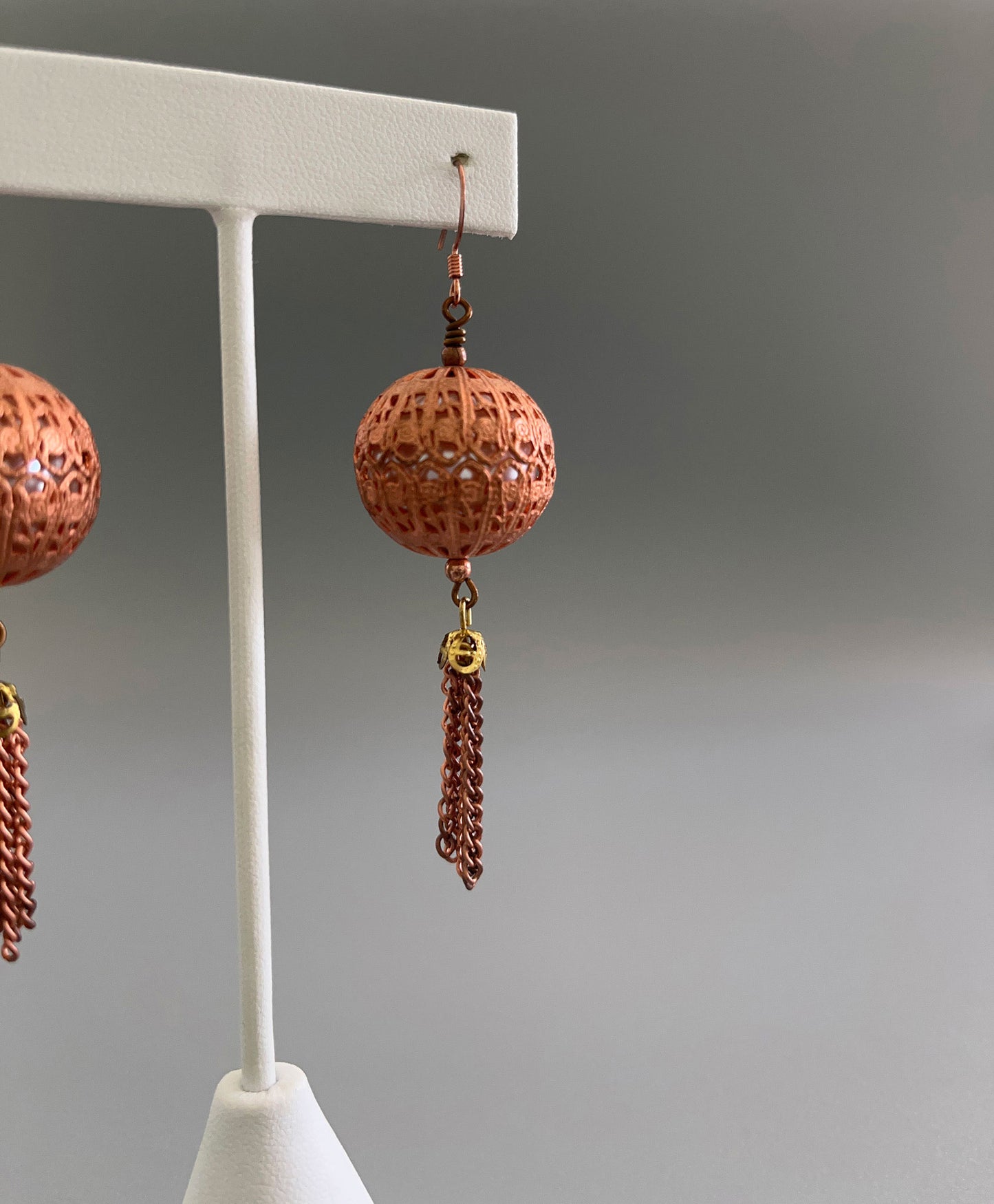 Copper filigree and pearl tassel earrings side view